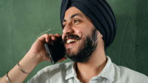 Sikh Man having a phone call and smiling