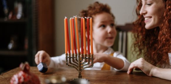 Mother and child celebrating Hannukah