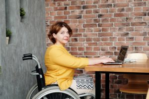 Wheelchair user working from home