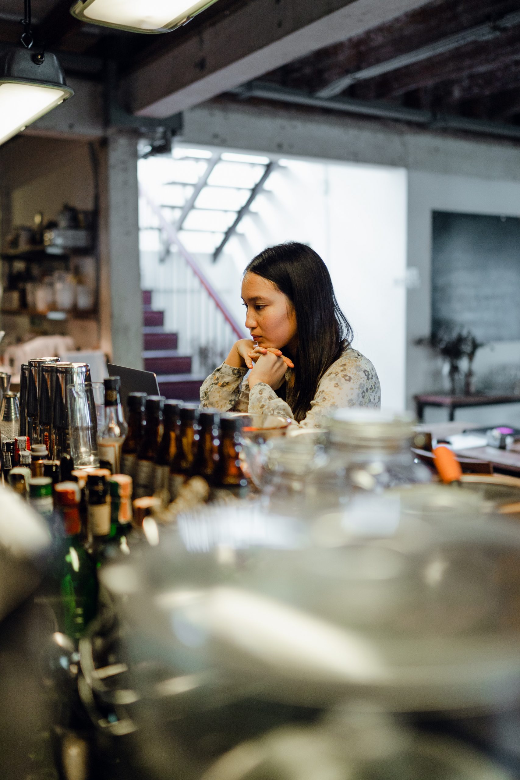 lonely woman sitting inside empty pub