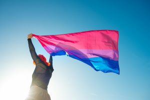Woman holding bi pride flag