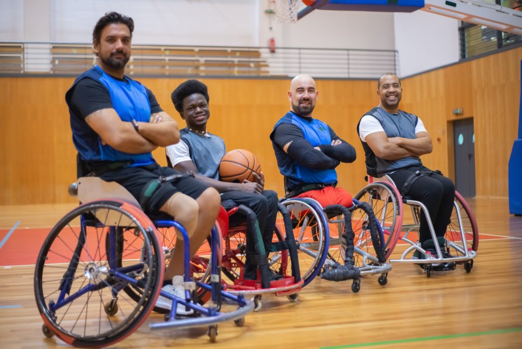 Wheelchair basketball team posing for a photo