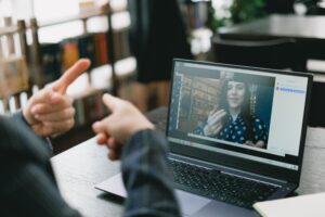 Two people on a video call using sign language to communicate