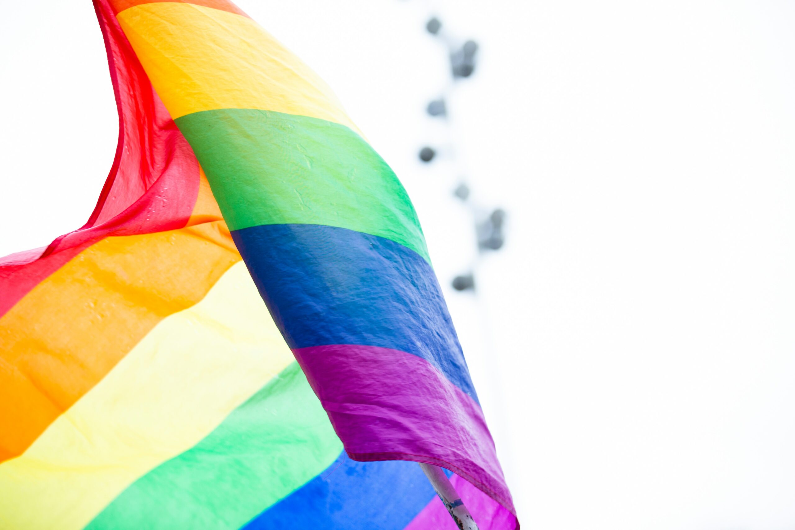 A 6 stripe rainbow pride flag waving in the wind