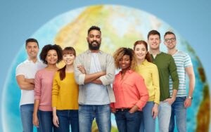 International staff stay in-front of a superimposed image of a globe