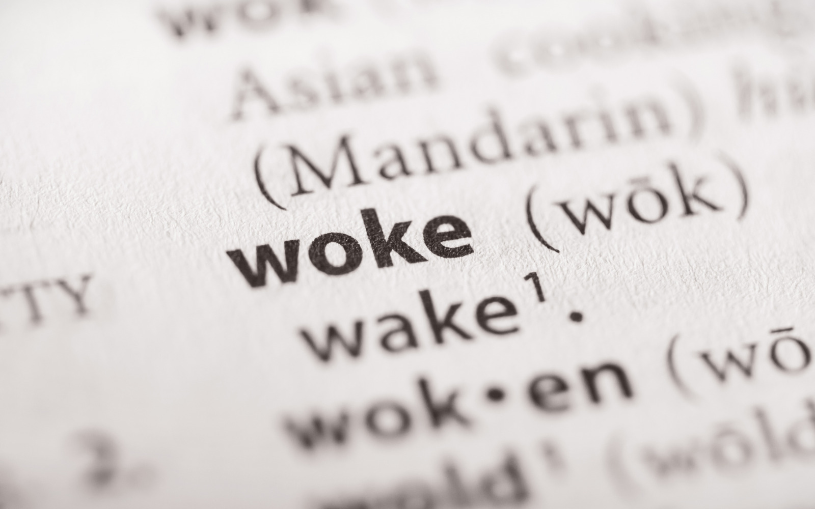 The word 'woke' on a page.