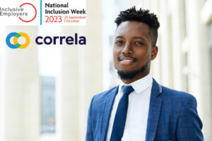 How to engage your employees in inclusion. A masculine, black office worker wearing a suit in front of a tall white building. They are smiling at the camera. In the background floats the National Inclusion Week logo and the Correla logo.