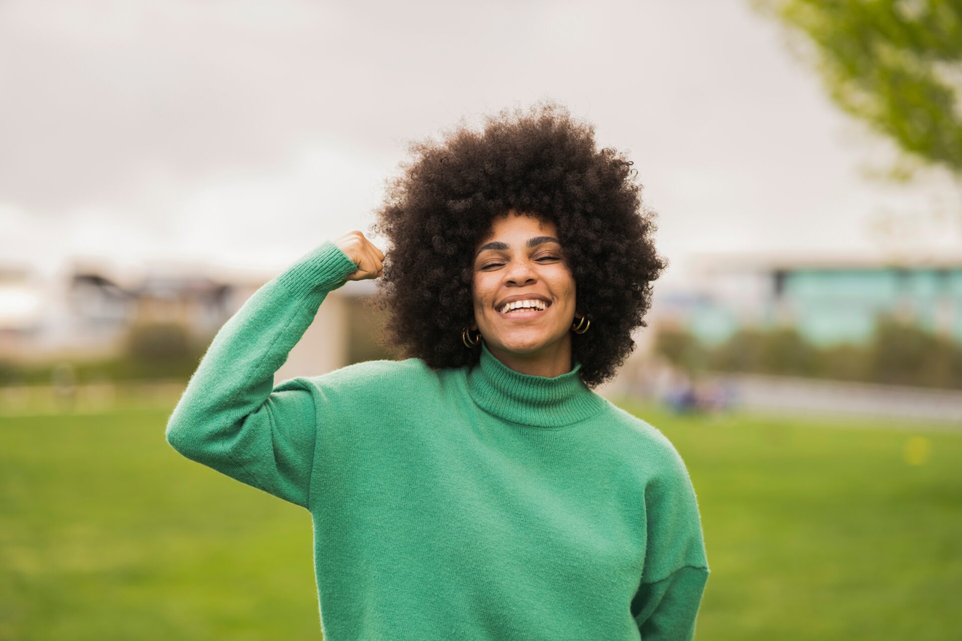 Empowered,Woman,Gesturing,With,Arms,Demonstrating,Strength