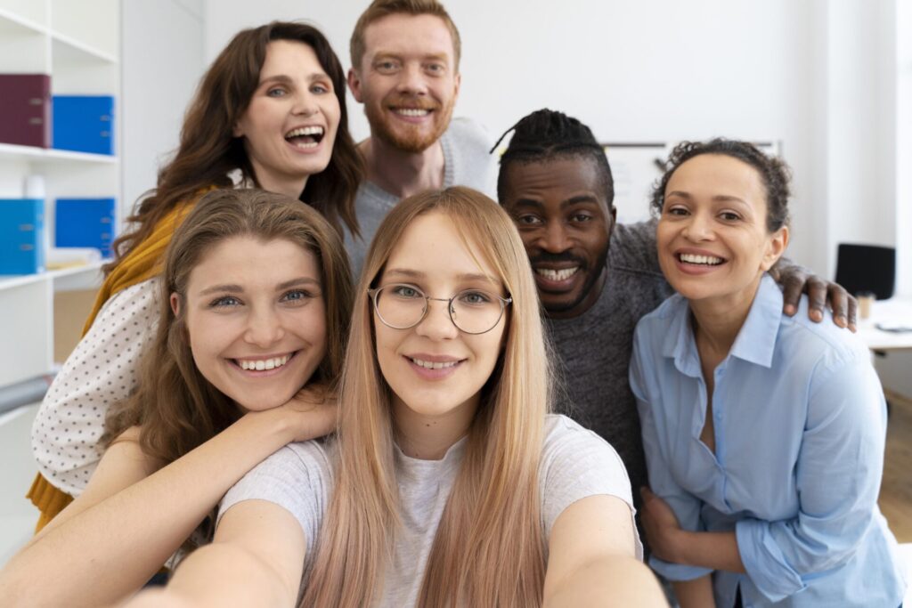 group of colleagues taking a selfie